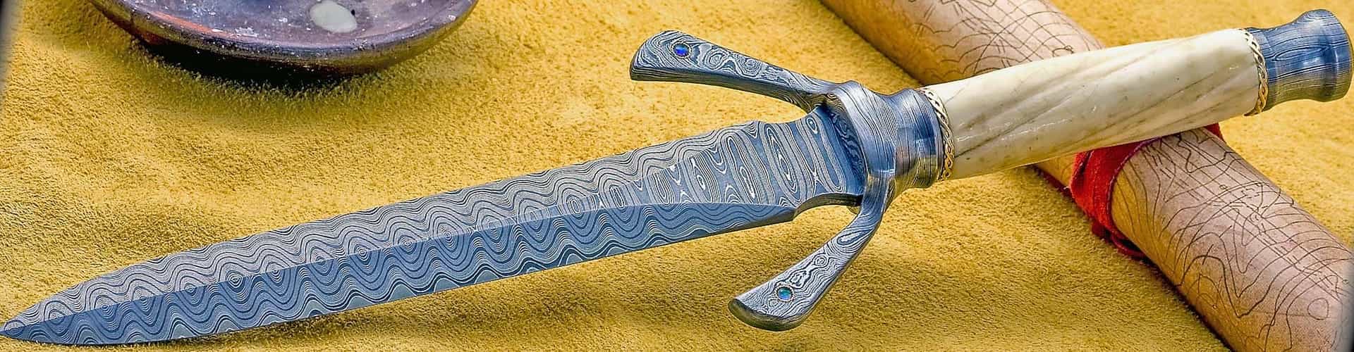 Narhwal tusk handled Damascus Dagger with gold fittings