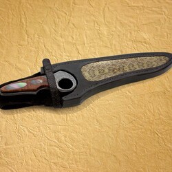 Subhilt Damascus knife in snake skin sheath