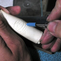 Golden band ring finger polish