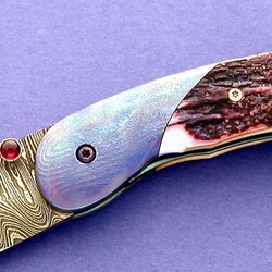Carbon Damascus and Timascus and Ivory Folder close up