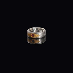 Damascus ring with genuine ruby set in 24 carat gold view