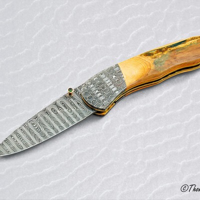 Stainless Mosaic Damascus Folder with Mammoth Ivory Gold and Peridot main view
