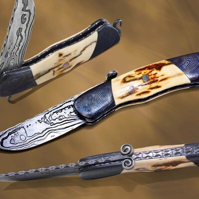 Voyageur, a Damascus folder with mammoth ivory handle