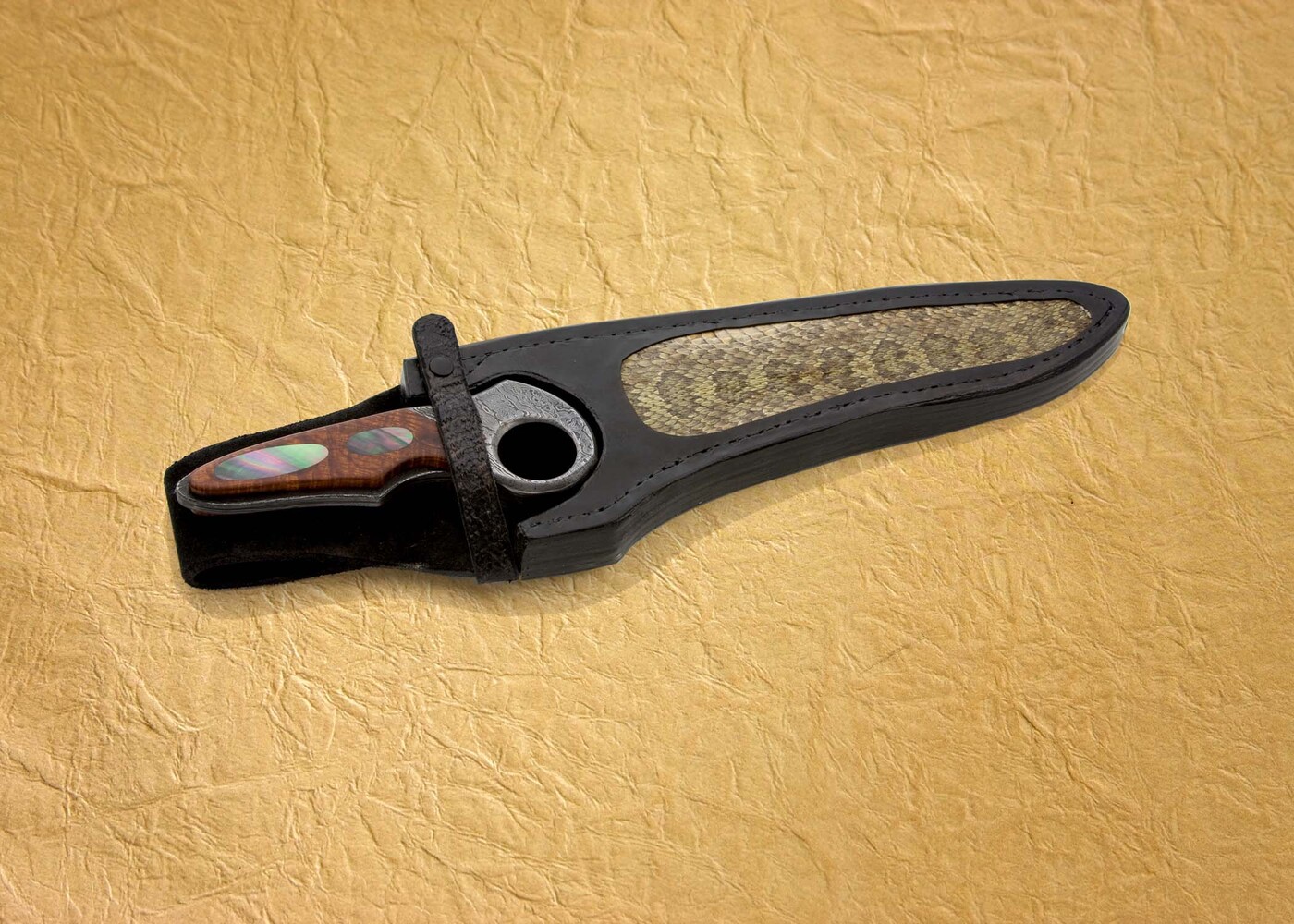 Subhilt Damascus knife in snake skin sheath