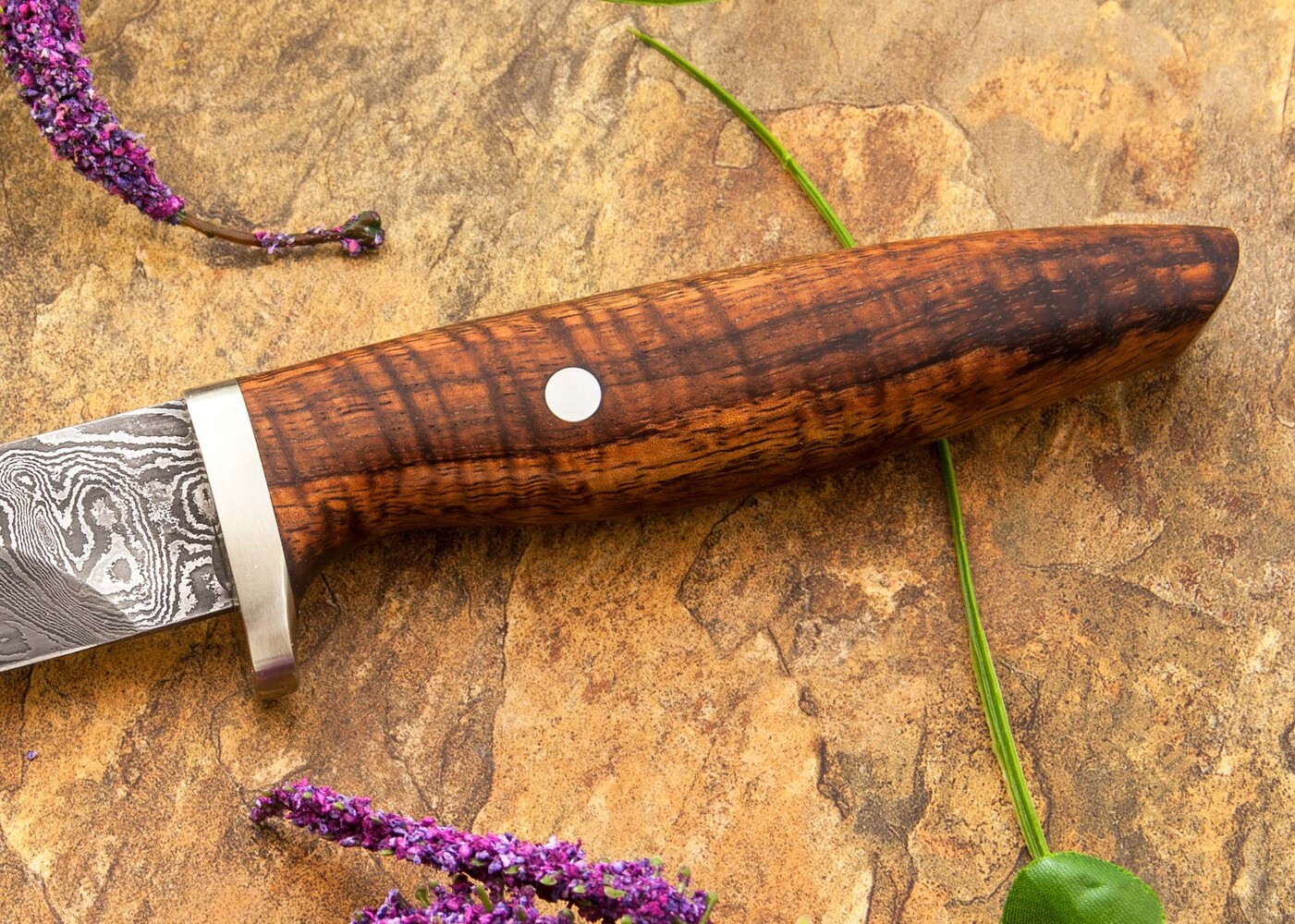 Random Damascus and Curly Koa Hunter close up